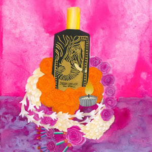 Black perfume bottle with gold elephant design.