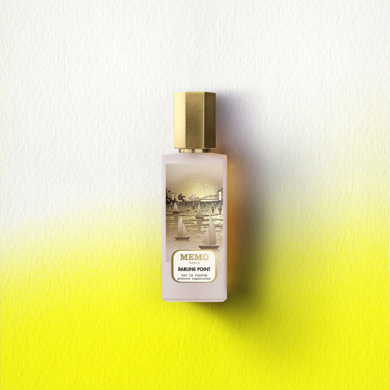 A sleek frosted glass perfume bottle with a gold cap featuring sailboats illustration for darling point unprecedented australian encounter